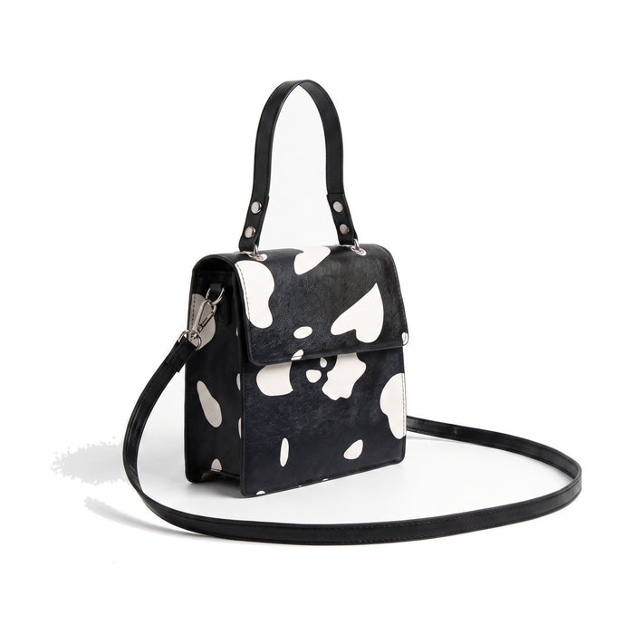 PETRA Leather Mini Handbag in cow print black